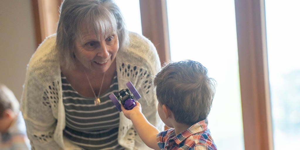 Woman cares for young child